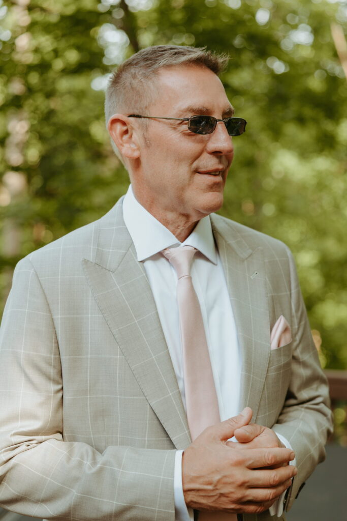 brides dad hanging out with groomsmen during getting ready