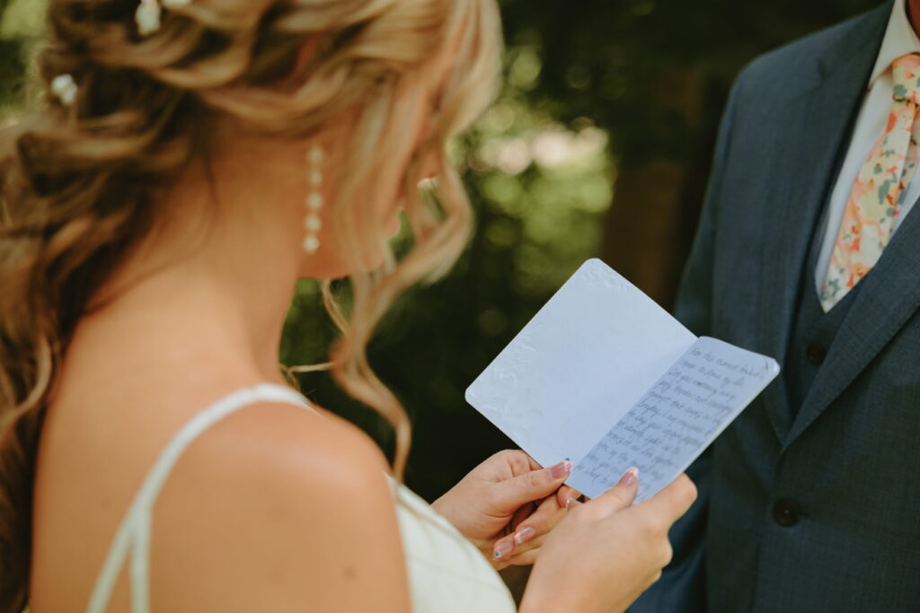 close up of bride reading vows