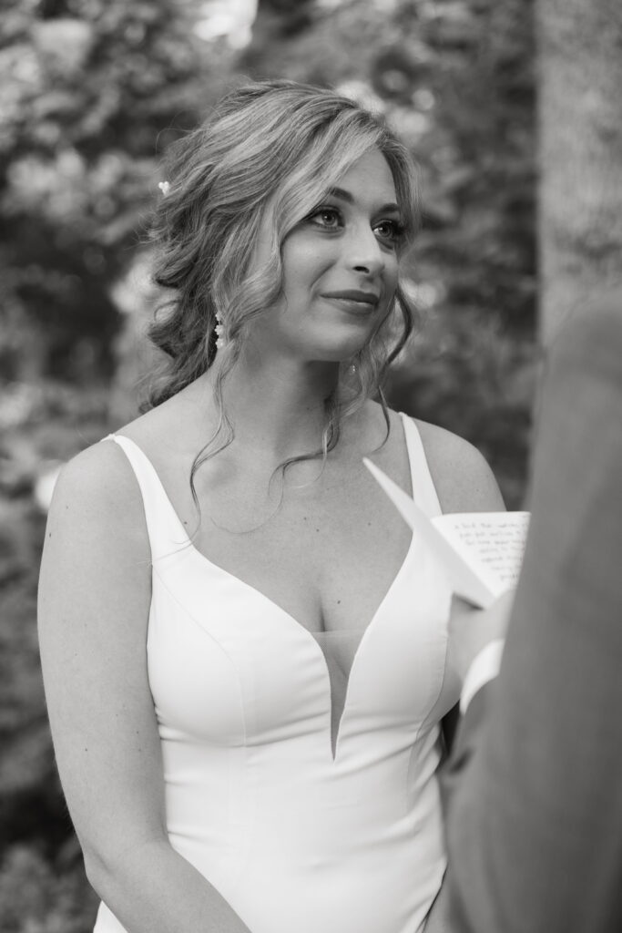grant reading vows, black and white photo of brides reaction