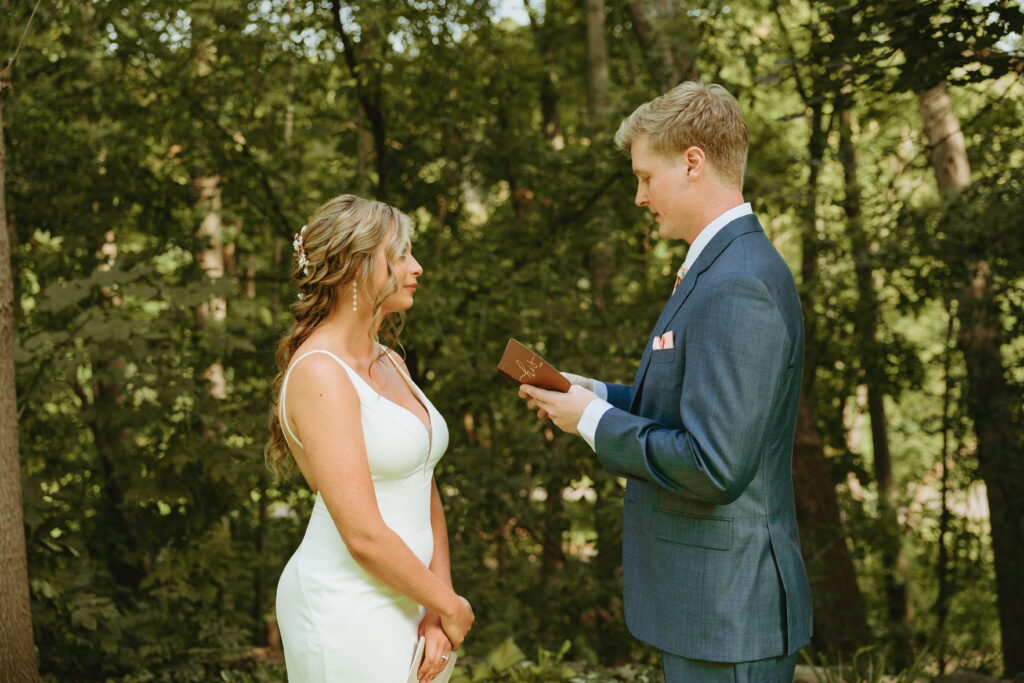 groom reading his vows to bride