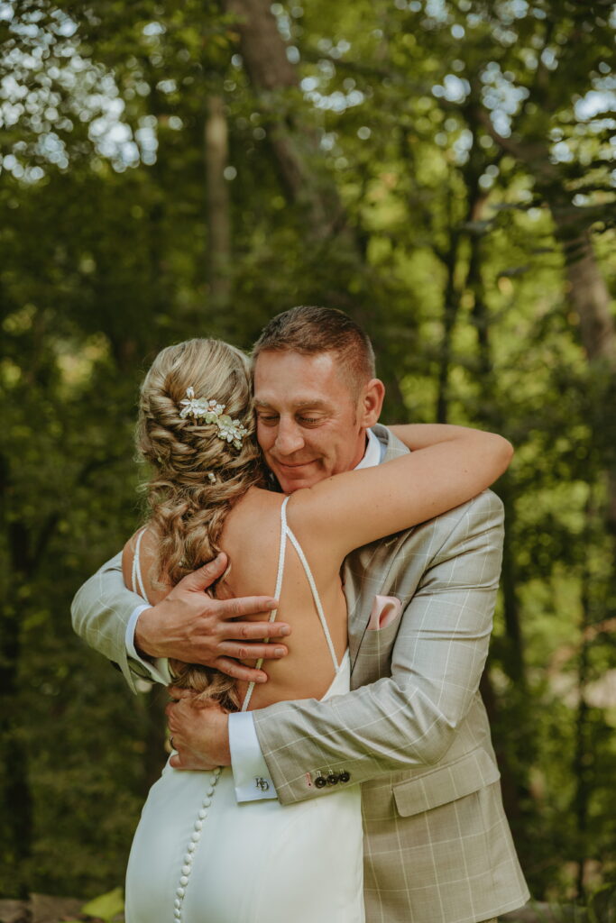 bride and dad hugging during the bride first look with her dad