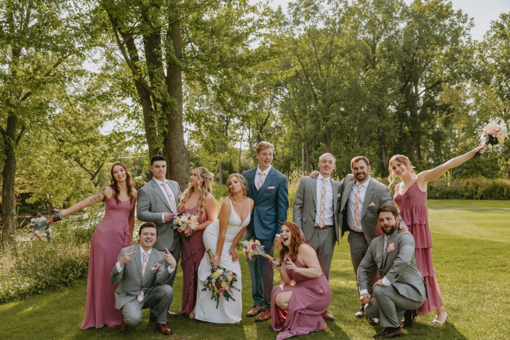 1,2,3 pose wedding party photo