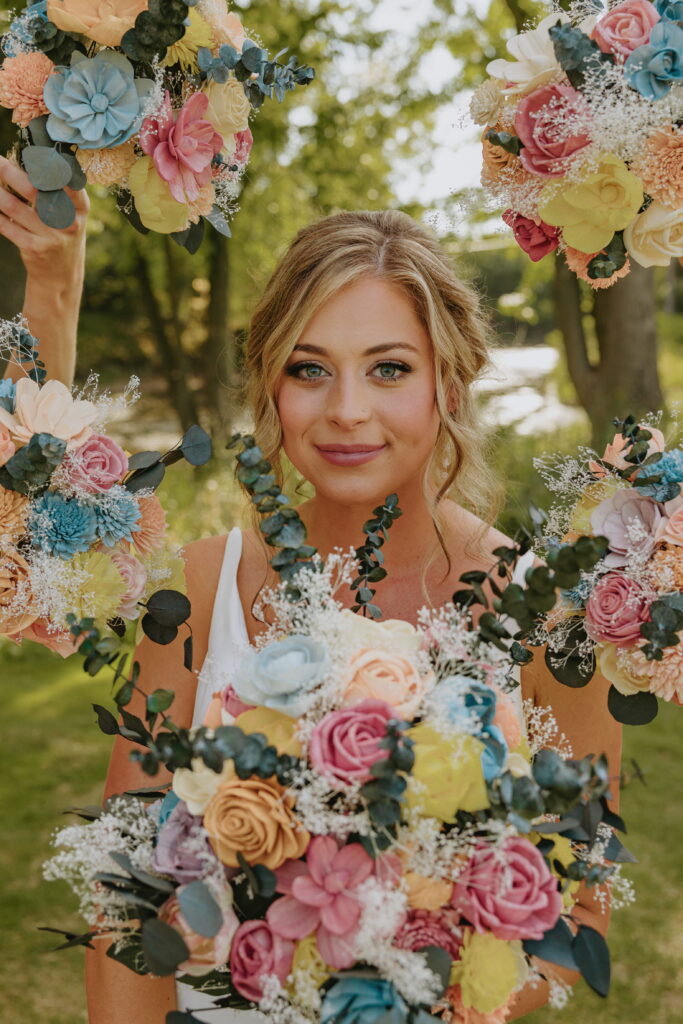 bridesmaid bouquets around bride