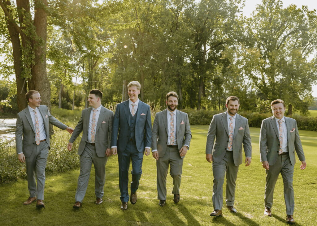 groomsmen walking at butte des morts country club