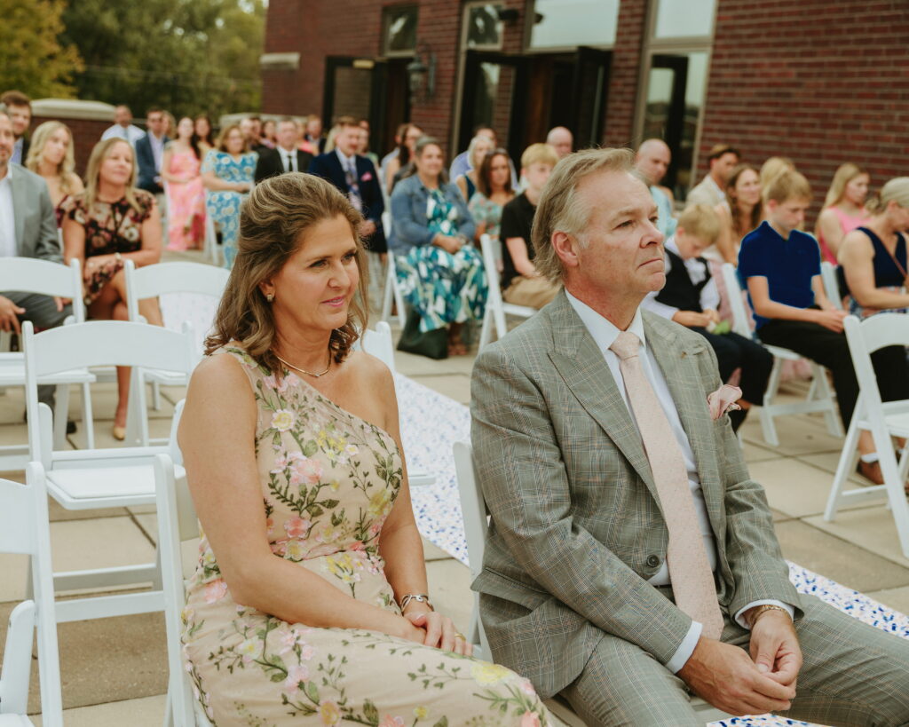 parents reactions at wedding ceremony overlooking golf course