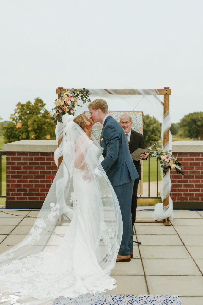 first kiss wedding ceremony overlooking golf course