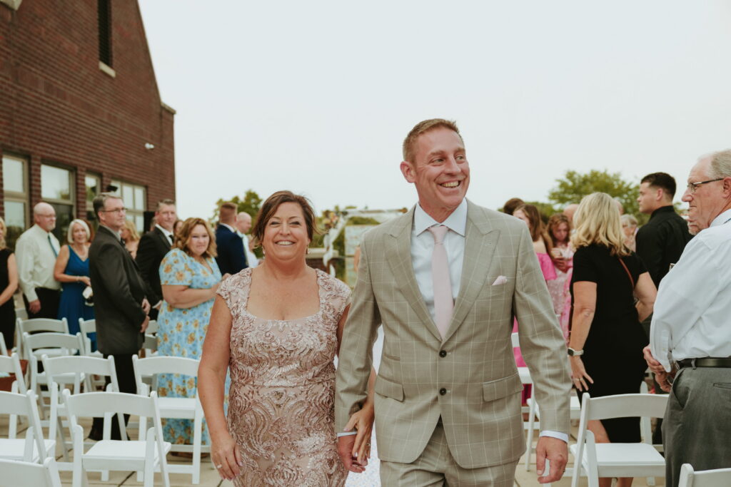 parents exiting wedding ceremony