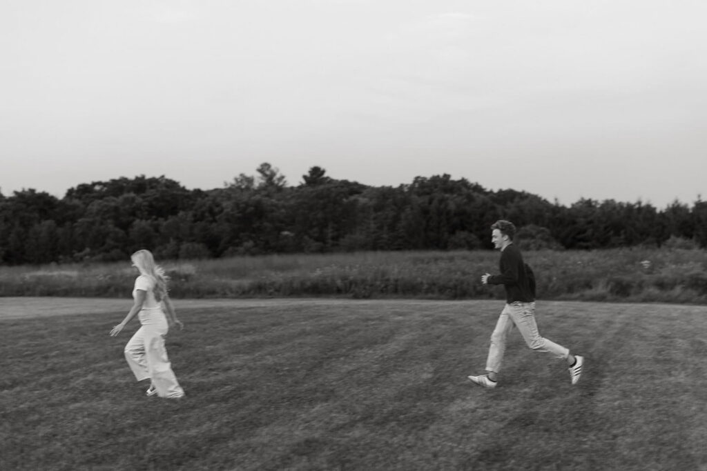 mikaela running away and eli running after her in field engagement
