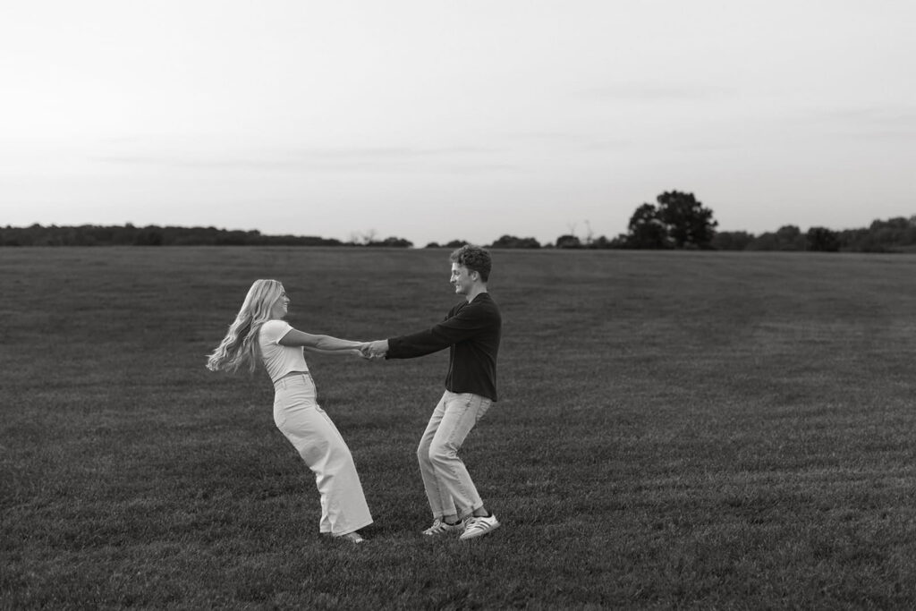 black and white pull and spin around engagement pose