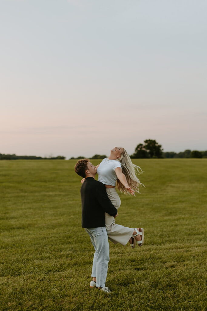 fun lift engagement photo with sunset into blue hour