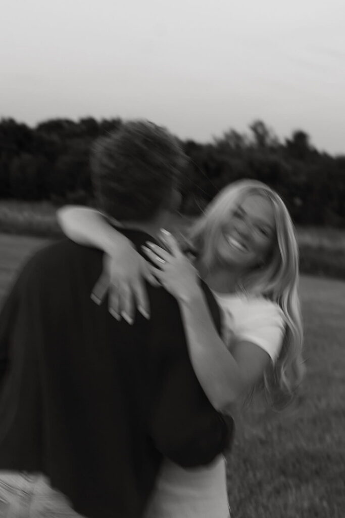 black and white motion blur with mikaela laughing and eli turned away