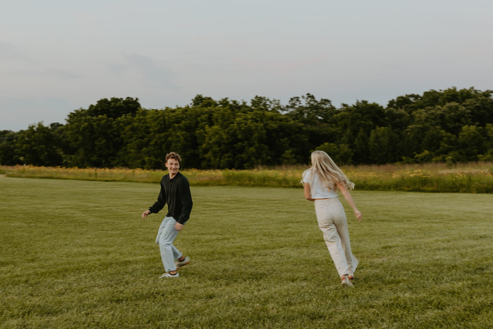 couple playing tag for engagement photos