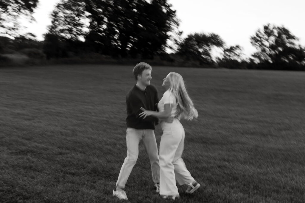 fun black and white engagement pic in nature