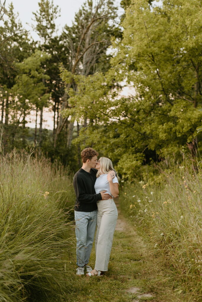 couple kissing for nature engagement pictures